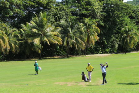 Orville Christie hits his fairway shot unto the green on the 7th hole at Tryall